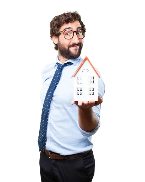 Crazy businessman with toy house — Stock Photo, Image