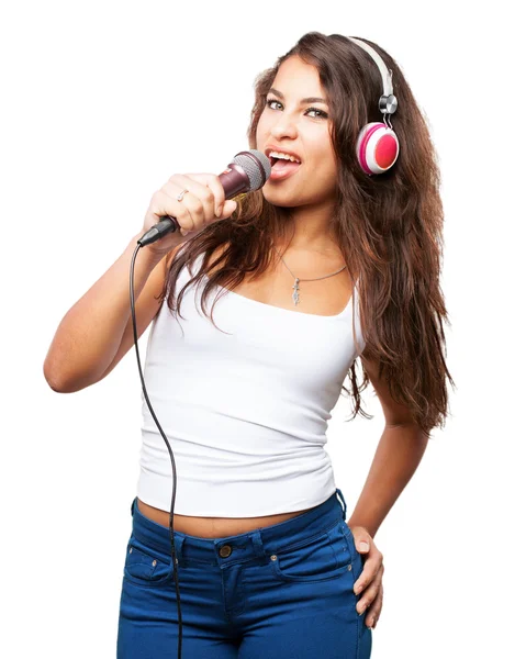 Joven negro chica con auriculares y micrófono —  Fotos de Stock