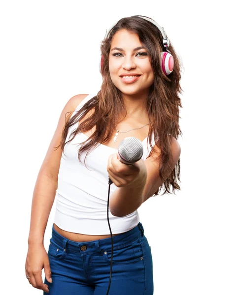 Joven negro chica con auriculares y micrófono —  Fotos de Stock