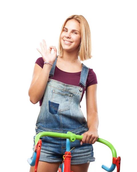 Young blond girl with bicycle — Stock Photo, Image