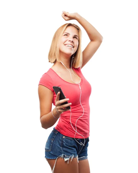 Girl luisteren muziek op mobiele telefoon — Stockfoto