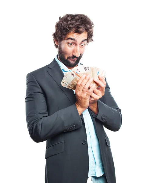 Сумасшедший бизнесмен с кучей денег — стоковое фото