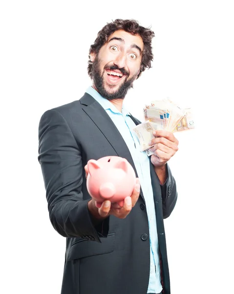 Crazy businessman with banknotes and piggy bank — Stock Photo, Image