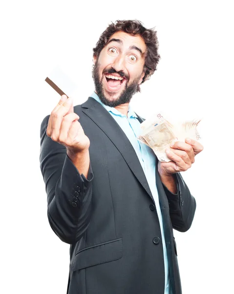 Crazy businessman with banknotes and credit card — Stock Photo, Image