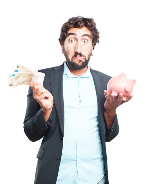 Crazy businessman with banknotes and piggy bank — Stock Photo, Image