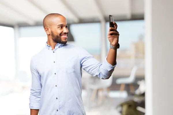 Black businessman using mobile phone — Stock Photo, Image