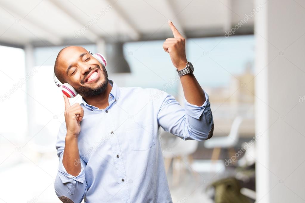 black man listening music on headphones stock photo kues 109258928