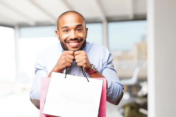 Hombre de negocios negro con bolsas de compras —  Fotos de Stock