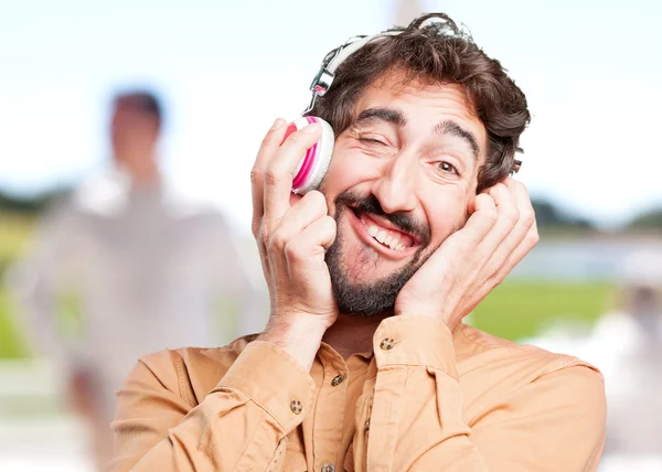 Loco hombre divertido con auriculares —  Fotos de Stock