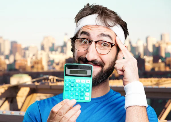 Crazy sports man with calculator — Stock Photo, Image