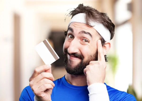 Crazy sports man with credit card — Stock Photo, Image