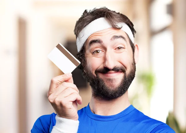 Fou sportif homme avec carte de crédit — Photo