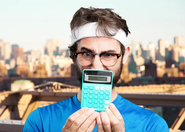 Crazy sports man with calculator — Stock Photo, Image