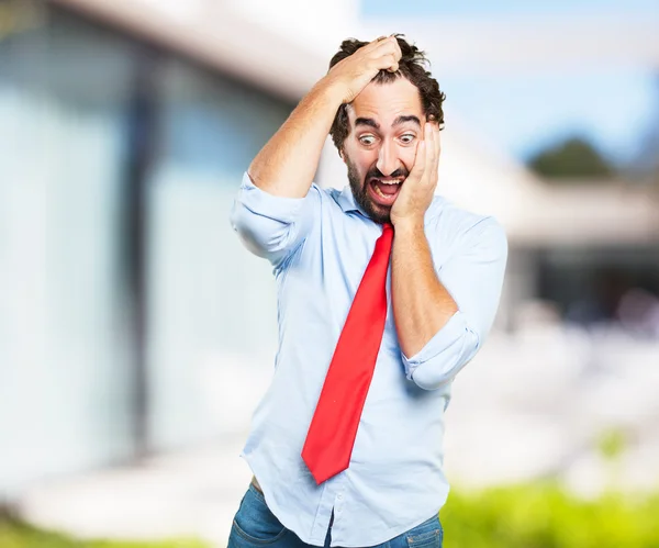 Crazy businessman with worried expression — Stock Photo, Image