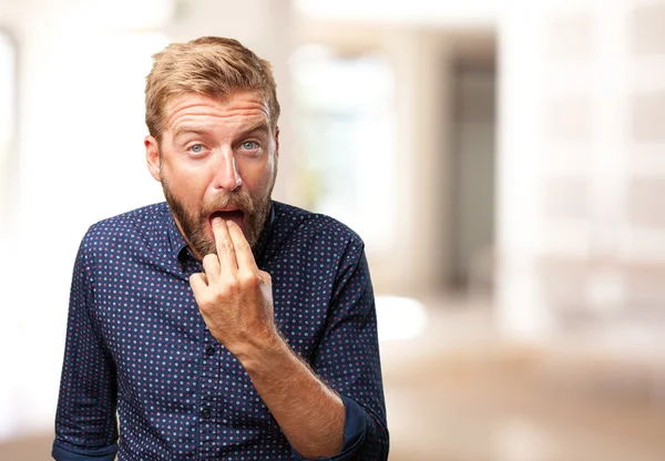 Blond man with angry expression — Stock Photo, Image