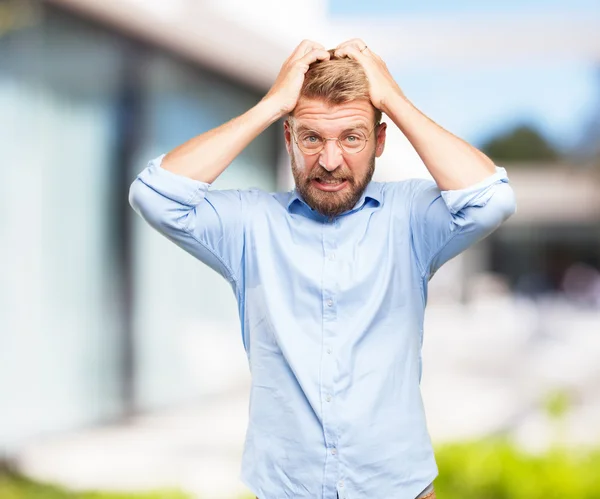 Crazy businessman with worried expression — Stock Photo, Image