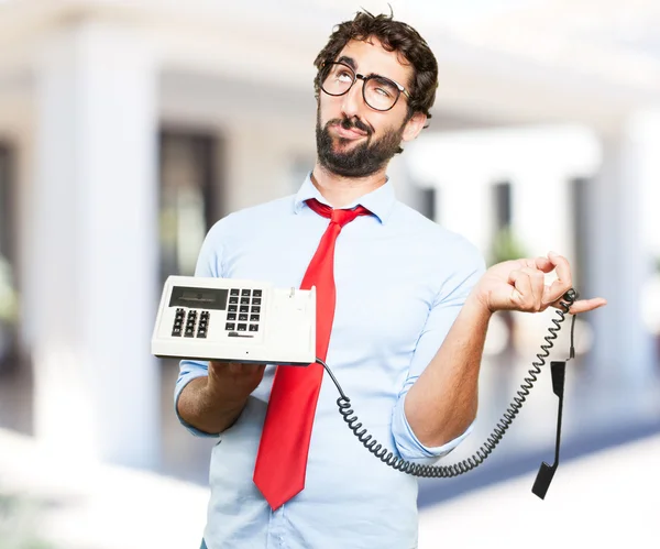 Loco hombre de negocios con teléfono viejo — Foto de Stock