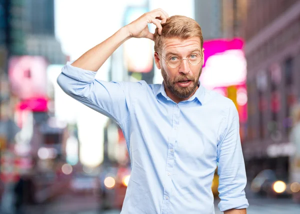 Blond businessman with surprised expression — Stock Photo, Image