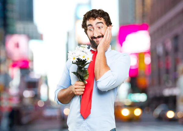 Crazy businessman with bouquet of flowers — Stock Photo, Image