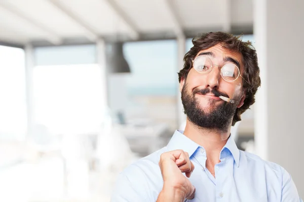 Crazy hippie man smoking a cigarette — Stock Photo, Image