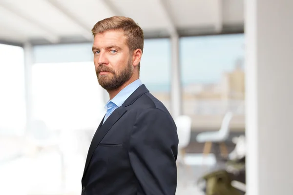 Blond businessman with happy expression — Stock Photo, Image