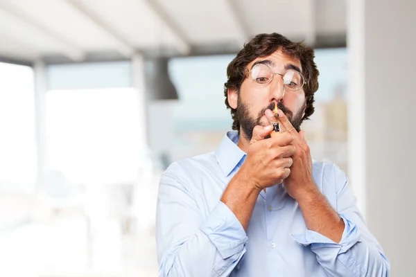 Crazy hippie man smoking a cigarette — Stock Photo, Image