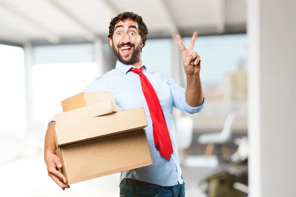 Crazy businessman with boxes — Stock Photo, Image