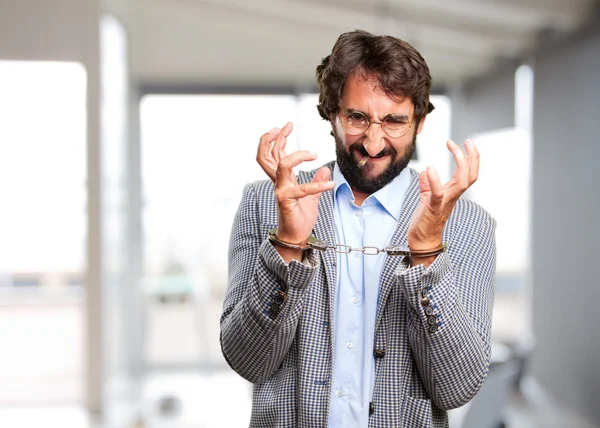 Crazy hippie man in handcuffed — Stock Photo, Image