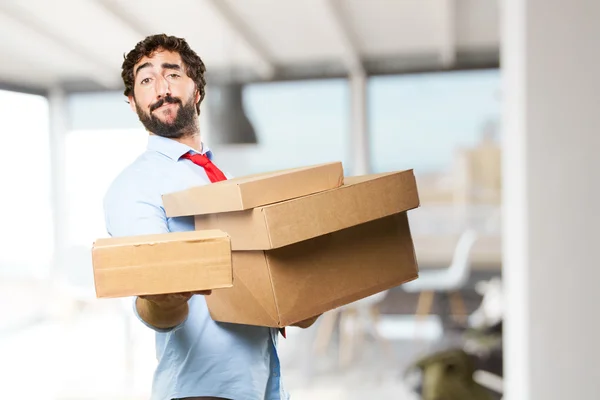 Crazy businessman with cardboard boxes — Stock Photo, Image