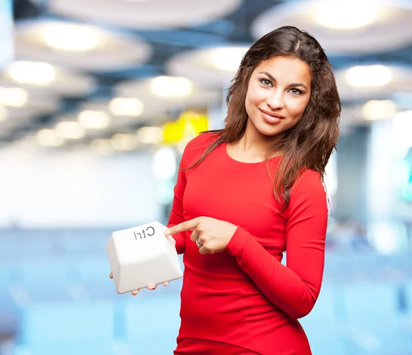 Young black girl with control key — Stock Photo, Image