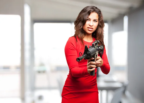 Young black girl with gun — Stock Photo, Image