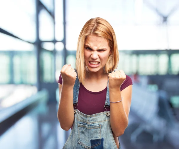 Blond girl with angry expression — Stock Photo, Image