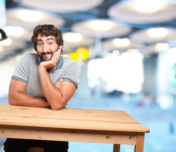 Man at table with happy expression — Stock Photo, Image
