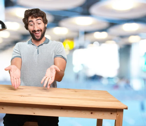 Man at table with happy expression — Stock Photo, Image