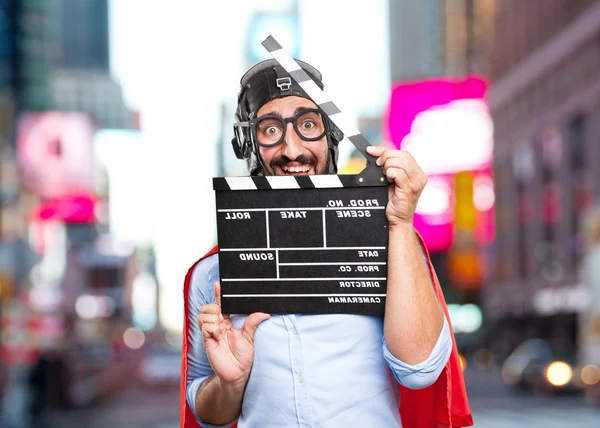Crazy hero man with clapperboard — Stock Photo, Image