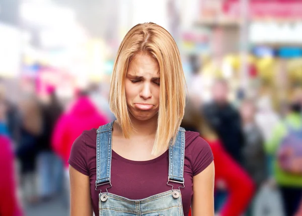 Blond girl with sad expression — Stock Photo, Image
