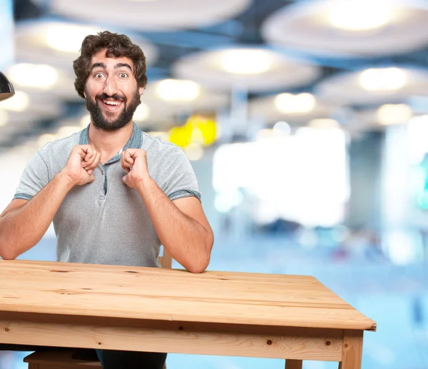 Man at table with happy expression — Stock Photo, Image