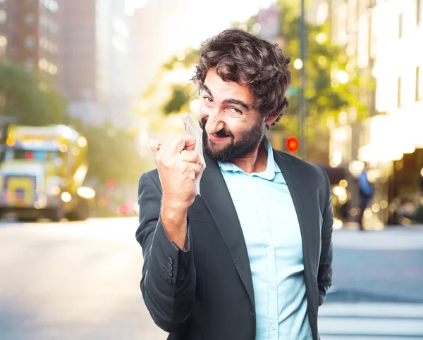 Crazy businessman with banknotes and toy plane — Stock Photo, Image