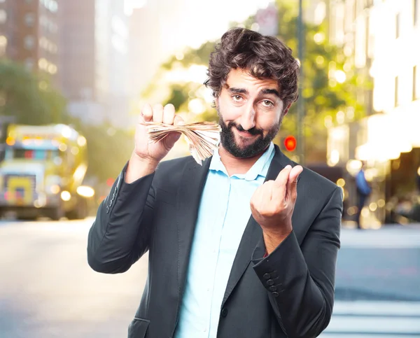 Crazy businessman with banknotes — Stock Photo, Image