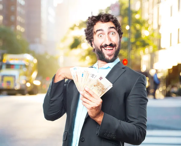 Crazy businessman with banknotes — Stock Photo, Image