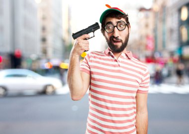 crazy young man with pistol clipart