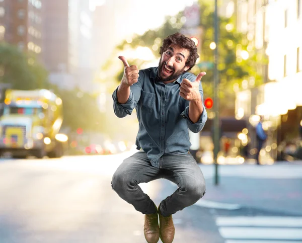 Crazy man jumping with happy expression — Stock Photo, Image