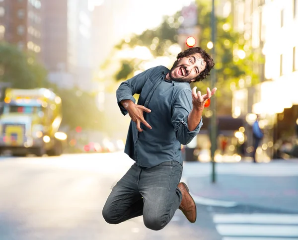 Loco saltando con expresión feliz —  Fotos de Stock