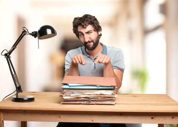Crazy man at table with documents — Stock Photo, Image