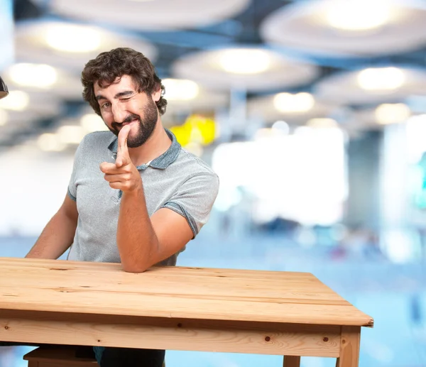 Man at table with happy expression — Stock Photo, Image