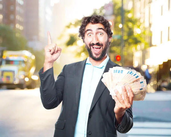 Crazy businessman with banknotes — Stock Photo, Image