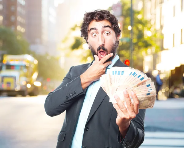 Сумасшедший бизнесмен с банкнотами — стоковое фото