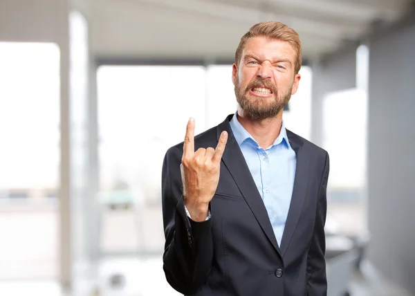 Hombre de negocios rubio con expresión enojada —  Fotos de Stock