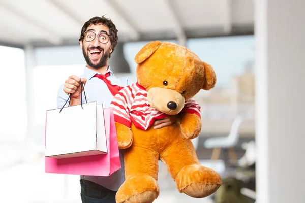 Podnikatel s Medvídek a nákupní tašky — Stock fotografie