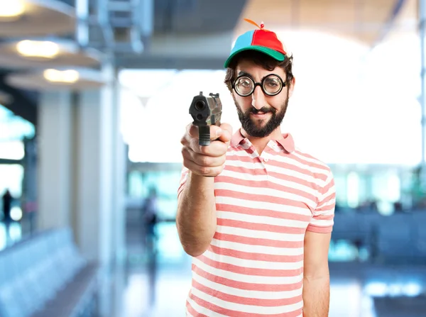 Crazy young man with pistol — Stock Photo, Image